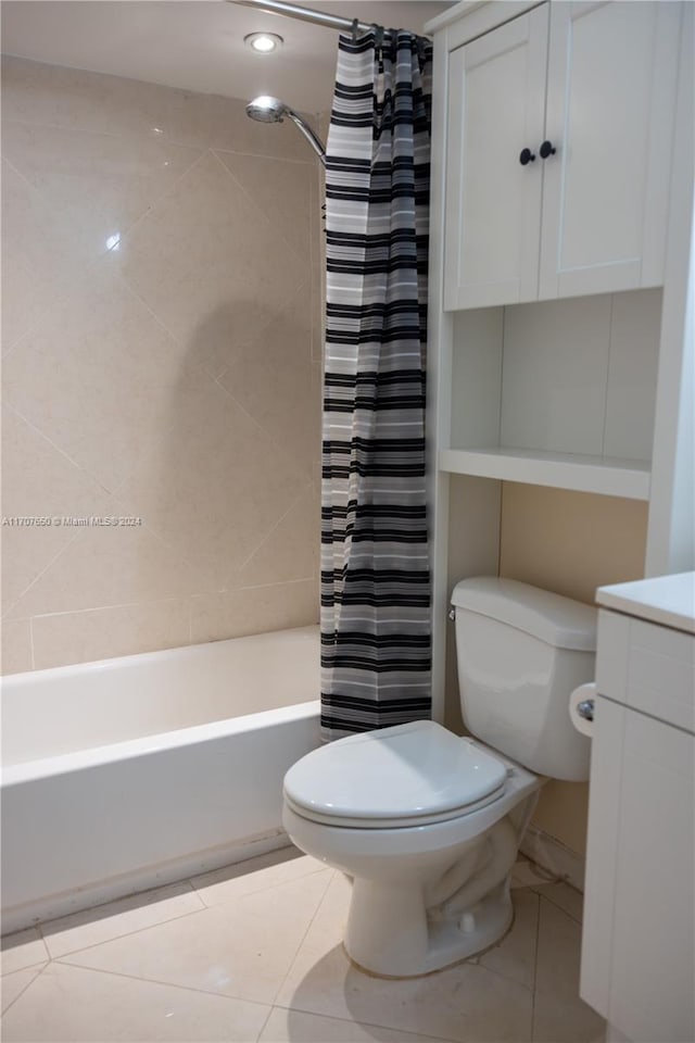 full bathroom featuring vanity, shower / bath combination with curtain, and toilet