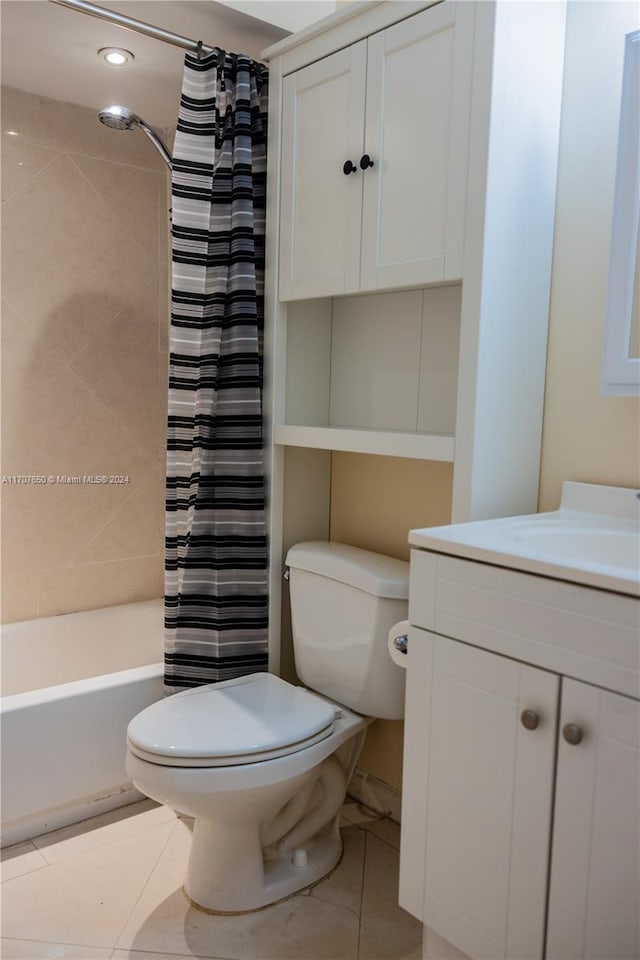 full bathroom with tile patterned flooring, vanity, toilet, and shower / tub combo