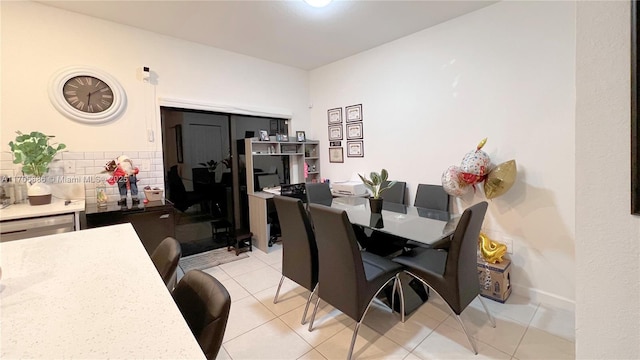 dining space featuring light tile patterned floors