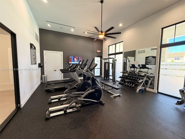 workout area featuring a wealth of natural light, baseboards, ceiling fan, and recessed lighting