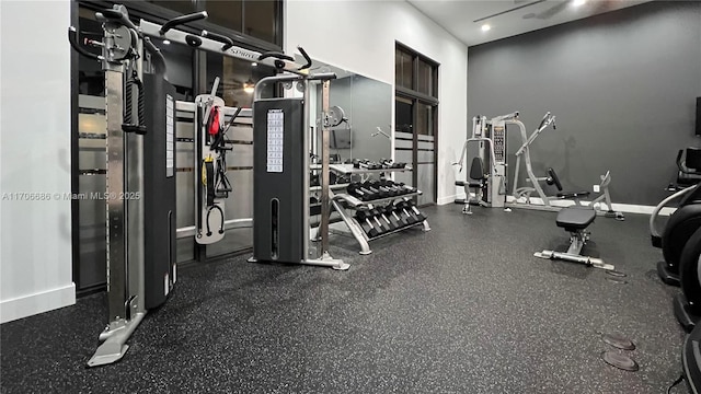 exercise room with ceiling fan