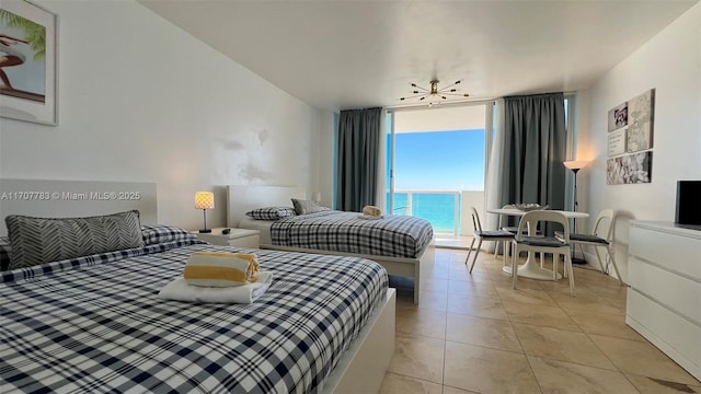 bedroom with floor to ceiling windows, access to exterior, multiple windows, and a water view