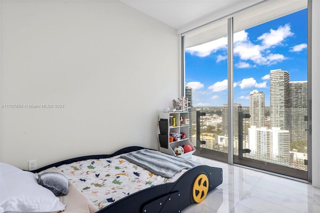 bedroom featuring access to outside and expansive windows