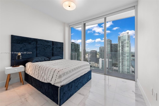 bedroom featuring access to outside and expansive windows