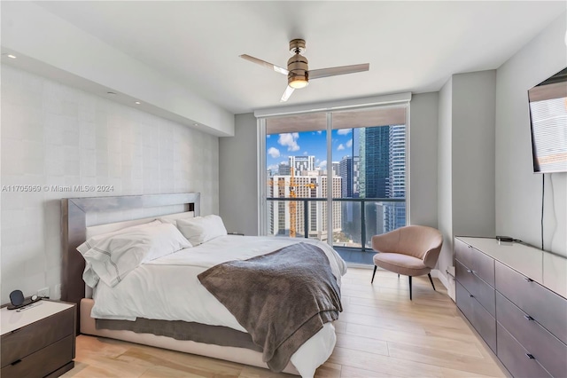 bedroom featuring light wood-type flooring and ceiling fan