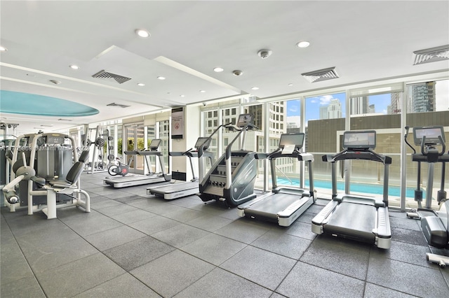 exercise room featuring expansive windows