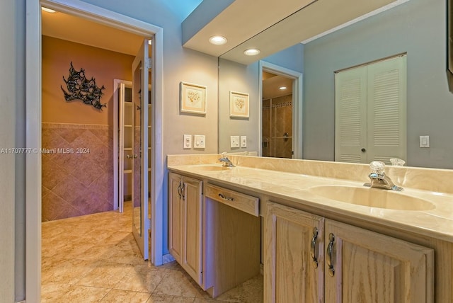 bathroom featuring vanity, tile patterned floors, and tile walls