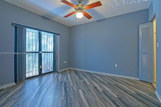 unfurnished room with ceiling fan, hardwood / wood-style floors, and a textured ceiling