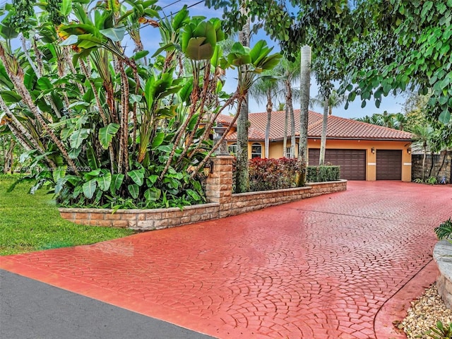 view of front of home featuring a tiled roof and stucco siding