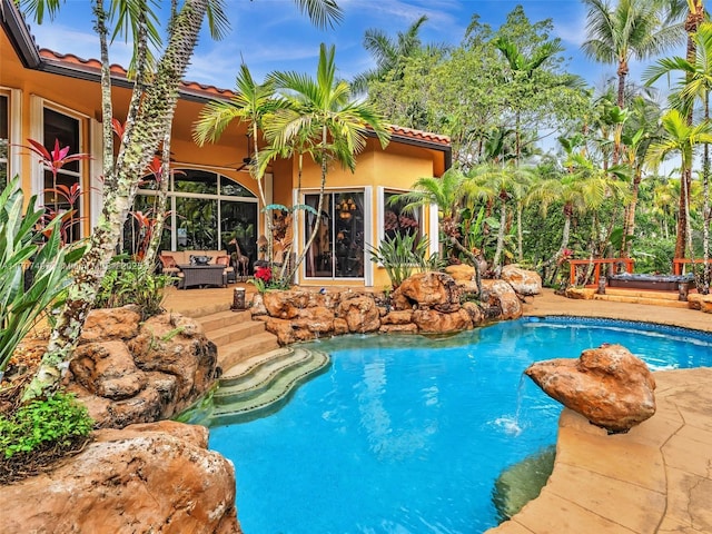 view of swimming pool featuring outdoor lounge area and a patio