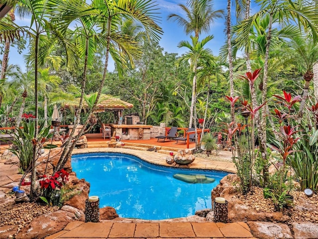 view of pool with a gazebo and a deck