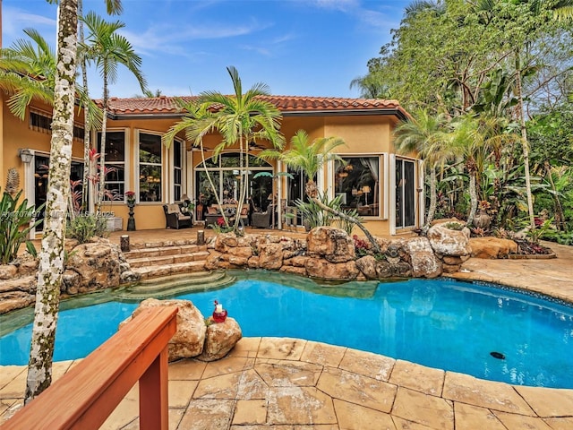 view of pool featuring a patio