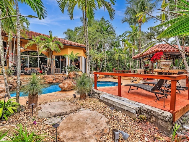 pool featuring a deck and a gazebo