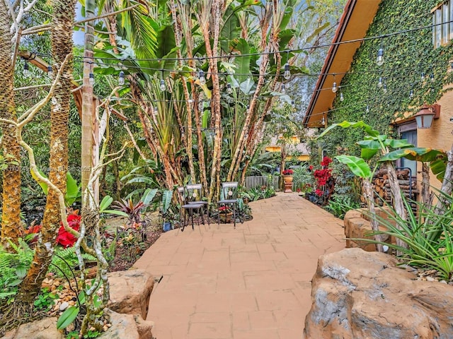 view of patio featuring fence