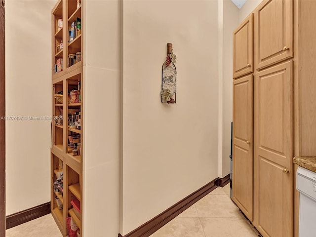 hallway with light tile patterned floors