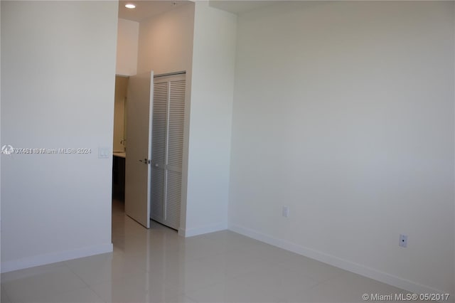 spare room with light tile patterned floors