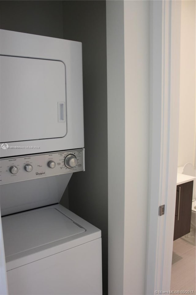 laundry area featuring stacked washer and dryer