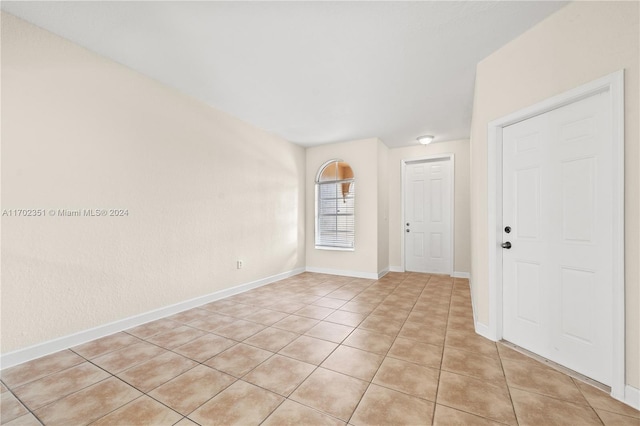 empty room with light tile patterned floors