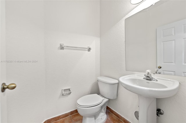 bathroom with tile patterned floors and toilet