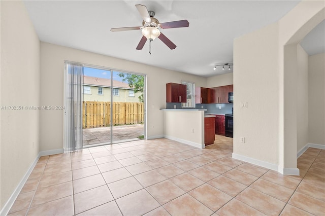 kitchen with ceiling fan, electric range, track lighting, and light tile patterned floors