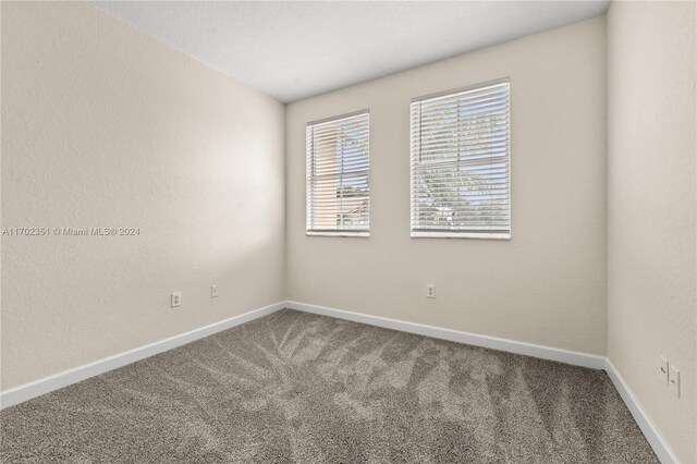 empty room with carpet flooring