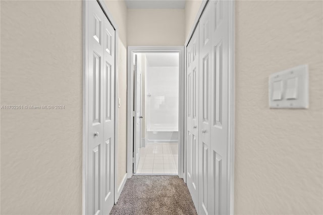 2557 SE 14th St, Homestead, FL 33035 - hallway with a textured wall and carpet flooring