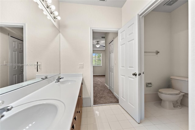 bathroom with tile patterned floors, vanity, and toilet