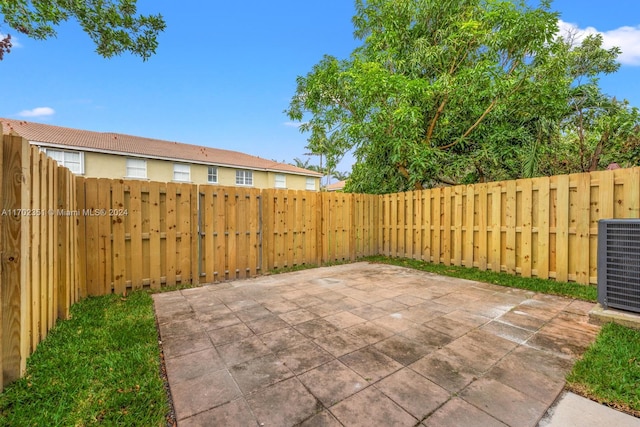 2557 SE 14th St, Homestead, FL 33035 - fenced backyard with a patio