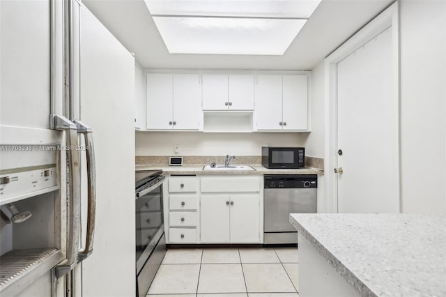 kitchen featuring black appliances, light tile patterned flooring, white cabinetry, and sink