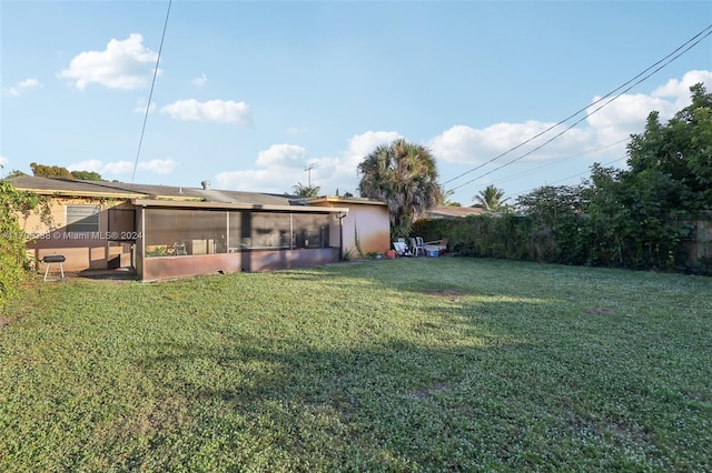 view of yard featuring a sunroom