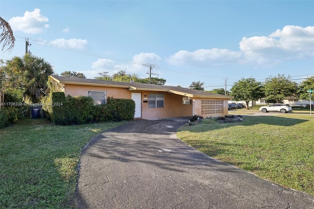 ranch-style house with a front yard