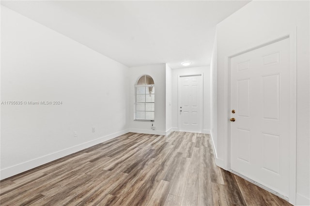 spare room with hardwood / wood-style flooring