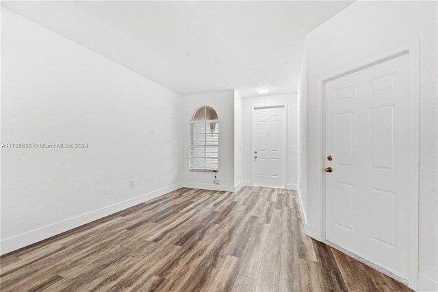 1476 SE 26th Ave, Homestead, FL 33035 - empty room featuring wood finished floors and baseboards