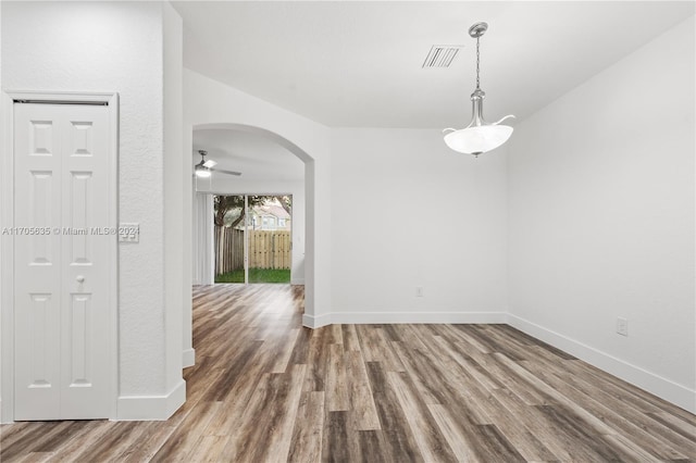 spare room with ceiling fan and hardwood / wood-style floors