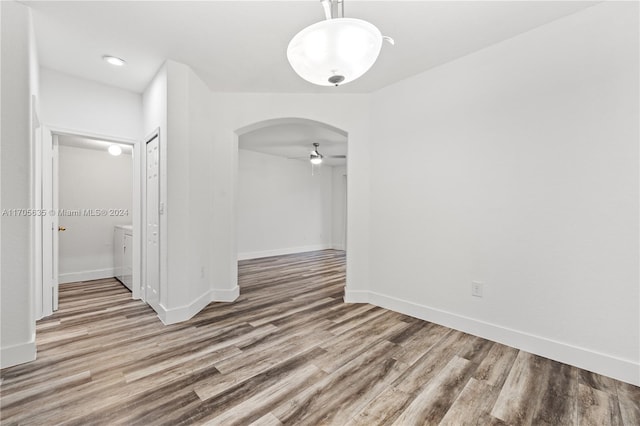 empty room featuring hardwood / wood-style flooring and ceiling fan