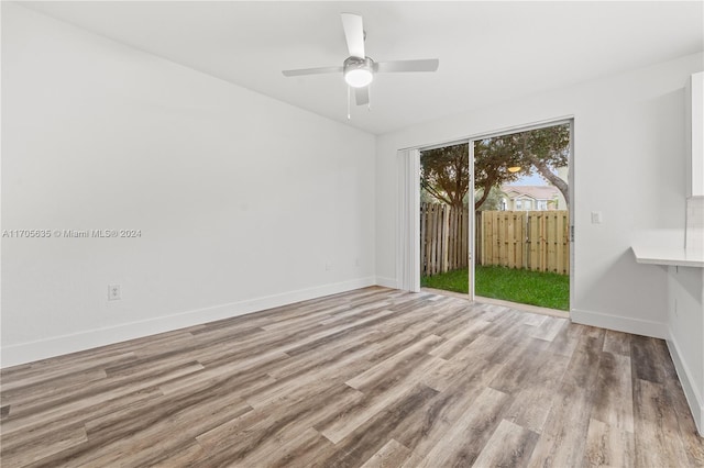 unfurnished room featuring ceiling fan and light hardwood / wood-style flooring