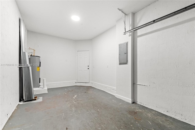 interior space with electric panel and water heater