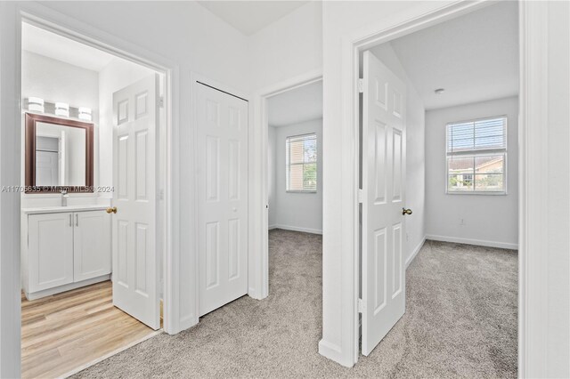 1476 SE 26th Ave, Homestead, FL 33035 - corridor featuring plenty of natural light and light carpet
