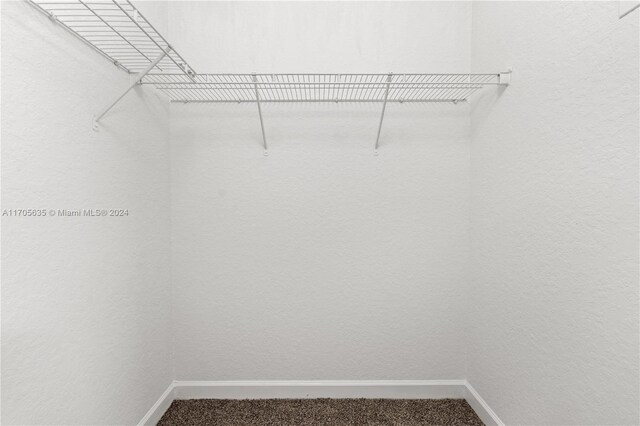 1476 SE 26th Ave, Homestead, FL 33035 - walk in closet featuring carpet floors