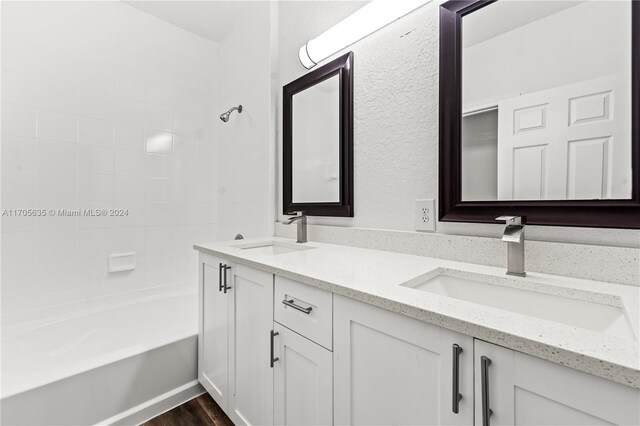 1476 SE 26th Ave, Homestead, FL 33035 - bathroom with double vanity, shower / bathtub combination, and wood finished floors