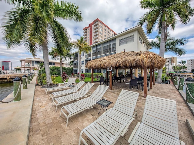 view of community with a water view and a patio