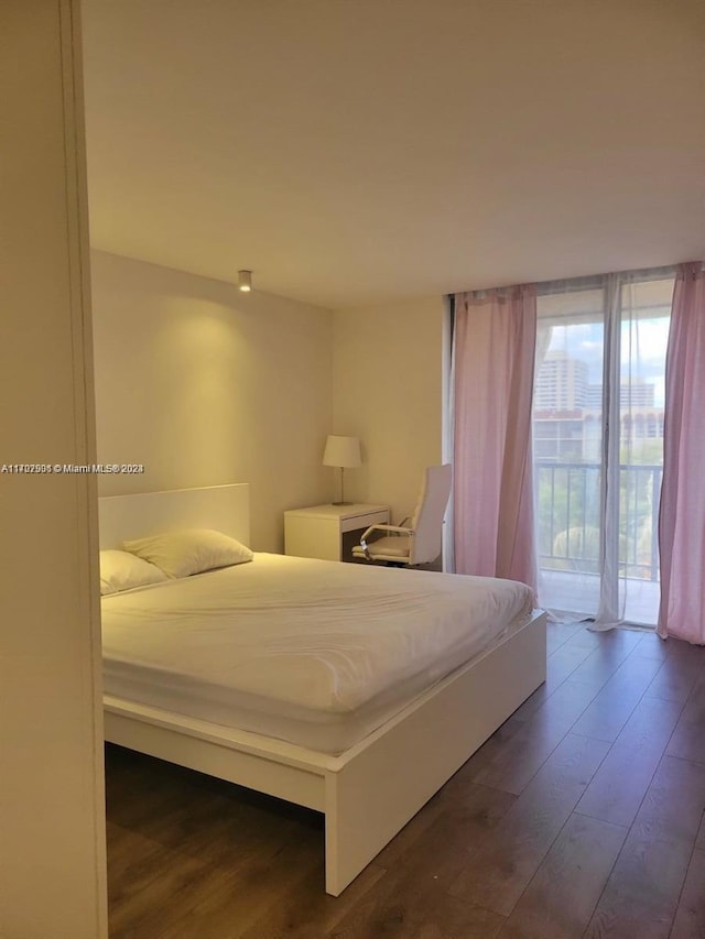 2001 Atlantic Shores Blvd Unit 510, Hallandale Beach, FL 33009 - bedroom with access to exterior and dark wood-type flooring
