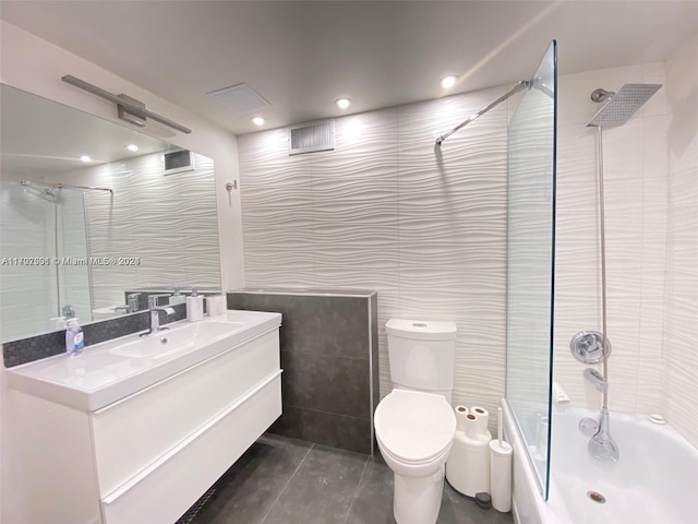 2001 Atlantic Shores Blvd Unit 510, Hallandale Beach, FL 33009 - full bathroom with tiled shower / bath combo, tile patterned floors, toilet, vanity, and tile walls