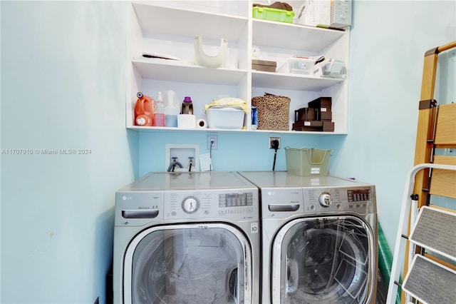 clothes washing area featuring washer and dryer