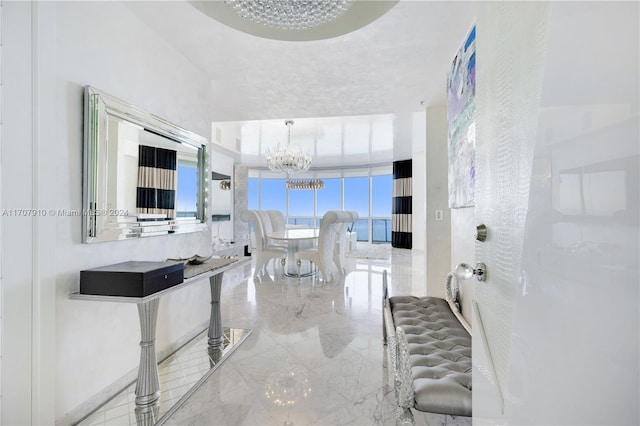 hallway featuring an inviting chandelier