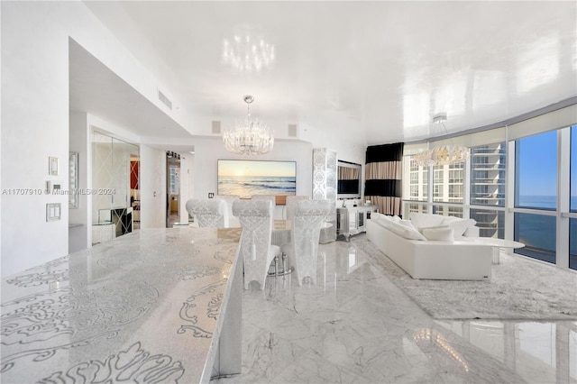 living room with an inviting chandelier