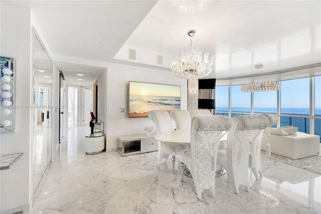 dining area featuring expansive windows, a water view, and an inviting chandelier