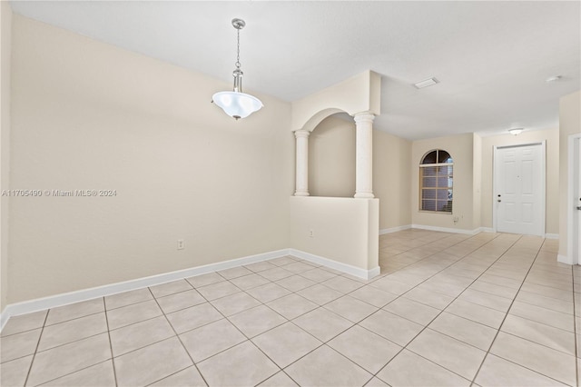 unfurnished room with light tile patterned floors