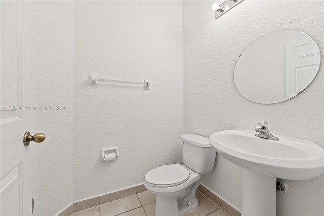 bathroom featuring tile patterned floors and toilet