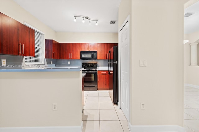 kitchen featuring light tile patterned flooring, backsplash, kitchen peninsula, and black appliances